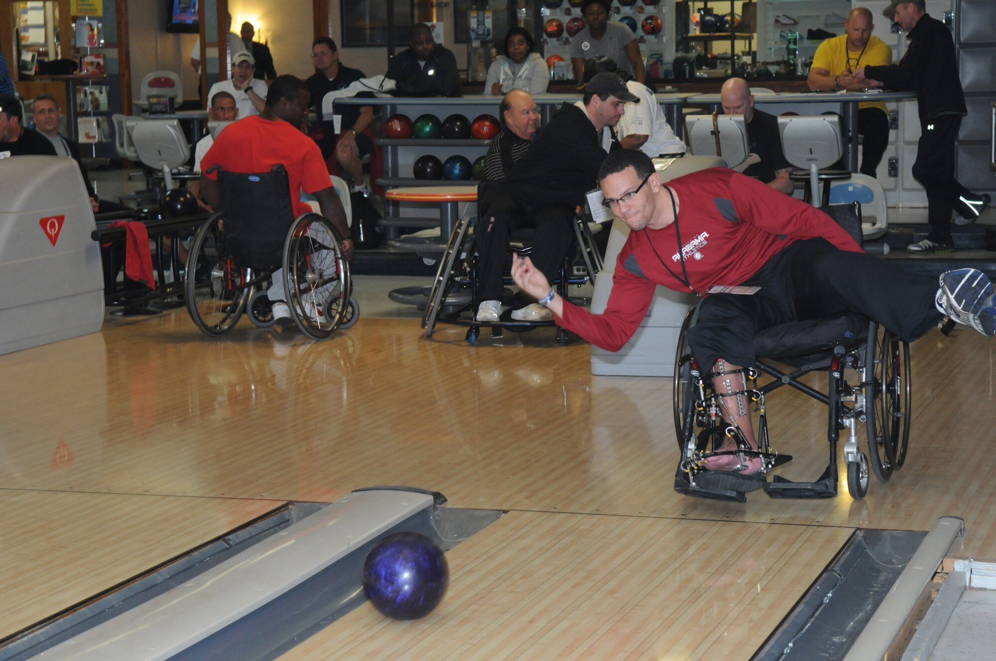 Johnnie Yellock, Adaptive Fitness and Sports Camp participant tries his hand at wheelchair bowling at the bowling ally on Joint Base San Antonio-Randolph Jan. 18. Forty five Air Force, Navy and U.S. Special Operations Command Wounded Warriors participated in the inaugural Adaptive Fitness & Sports Camp held at JBSA- Randolph  Jan. 18-21. Events included wheelchair basketball, sitting volleyball, cycling, aquatics, strength and conditioning, adaptive bowling and golf opportunities. (U.S. Air Force photo/Dona Fair) (released)
