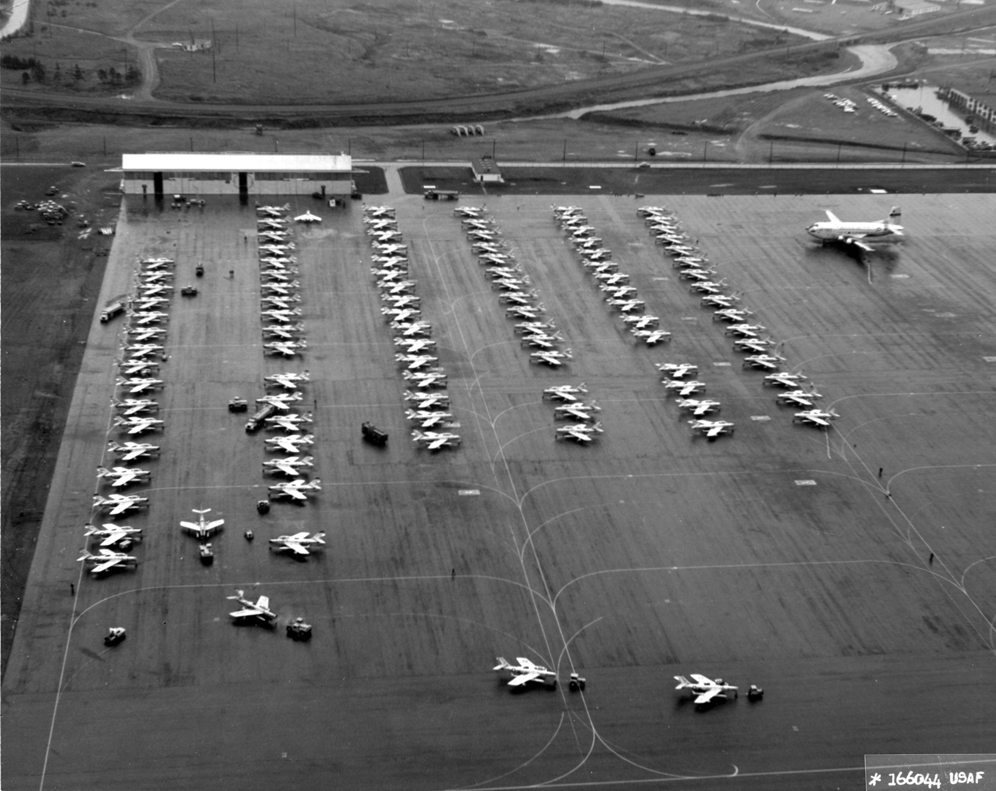 F-84Fs of the Federalized Air National Guard in Newfoundland, November 1961, prior to flying the Atlantic to Europe in response to the Berlin Crisis. Because of the long over-water distance to the next airfield in the Azores, the planes were towed to the end of the runway prior to takeoff to conserve fuel. During this Operation Stair Step deployment of more than 200 fighter aircraft (the largest overseas movement of a fighter force since World War II), not a single plane was lost. (U.S. Air Force photo)