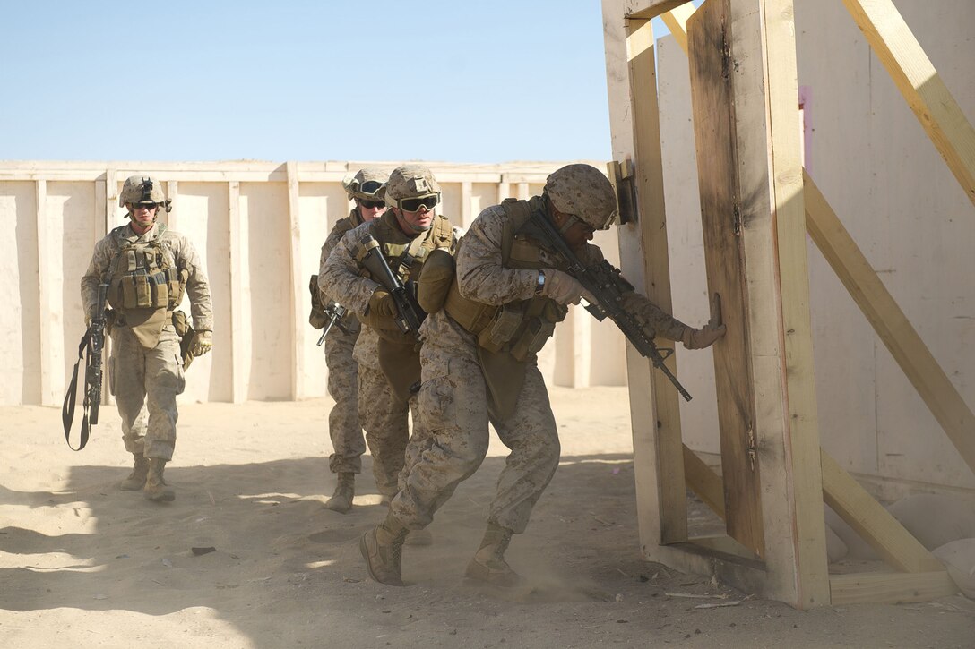 U.S. Marines assigned to Combat Logistics Battalion 11 breach a doorway Jan. 23 during a training event. The battalion provides logistics and services for the 11th Marine Expeditionary Unit. The 11th MEU is currently deployed as part of the Makin Island Amphibious Ready Group, a U.S. Central Command theater reserve force providing support for maritime security operations and theater security cooperation efforts here.