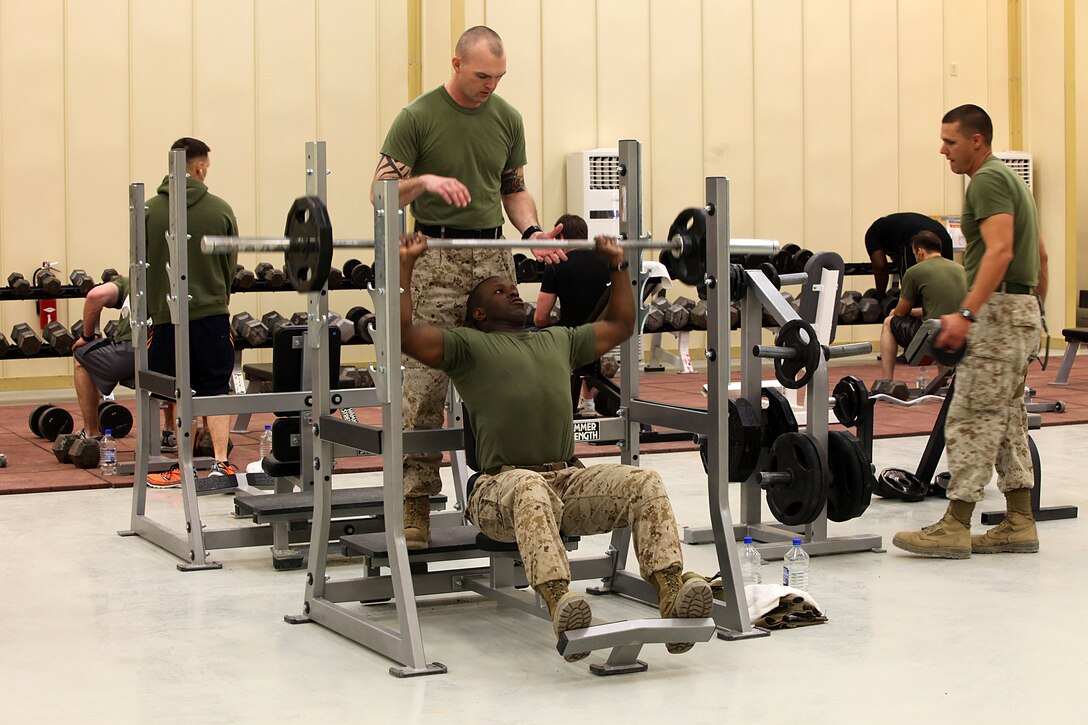 Marines working out in the newly constructed gym aboard Camp Delaram II. Even when deployed physical training is a huge part of being a Marine, they pride themselves on endurance, strength and toughness. Whether carrying 70 pounds of gear on the march or completing a 10-mile conditioning run, Marines give everything they have into staying in shape.