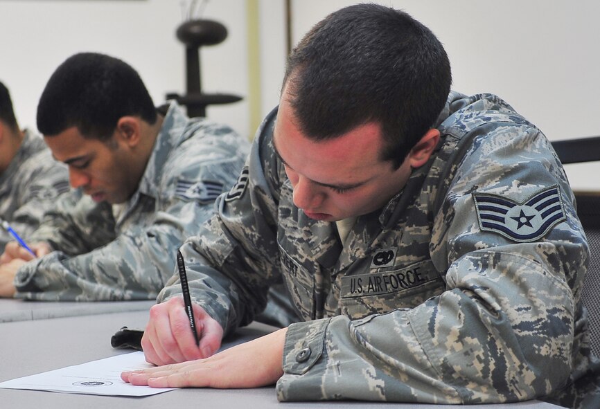 Staff Sgt. Nathaniel Calvert, 36th Aircraft Maintenance Unit weapons load crew member, takes a written examination during the 4th quarter load crew competition Jan 20, 2012 at Osan Air Base. The competition is comprised of a dress and appearance inspection, written exam, policies and procedures, and a load competition. Loaders from the 25th AMU loaded munitions onto an A-10 Thunderbolt II and the 36th AMU loaded an F-16 Fighting Falcon during the competition. (U.S. Air Force photo/Staff Sgt. Stefanie Torres) 

