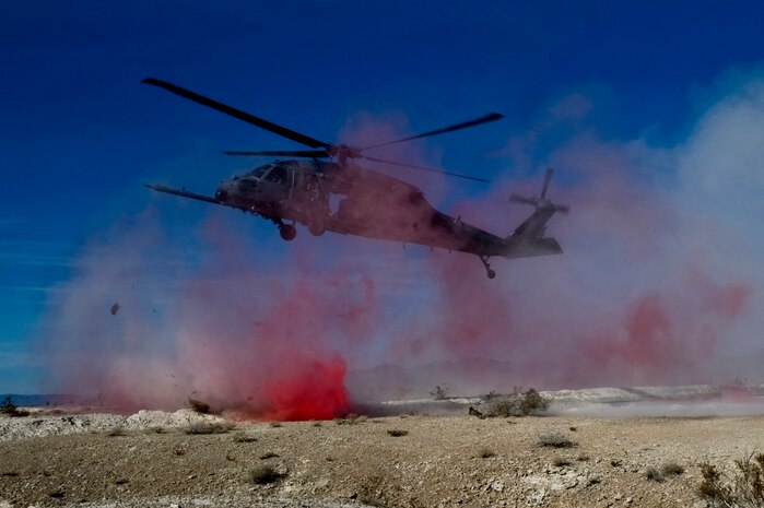 A U.S. Air Force HH-60 Pavehawk lands to extract a simulated downed pilot during a combat training mission Jan. 18, 2012, at the Nevada Test and Training Range. Pararescuemen, who rescued the simulated downed pilot during the mission, are trained to provide emergency medical treatment in adverse terrain and conditions in combat or peacetime. (U.S. Air Force photo by Airman 1st Class Daniel Hughes/Released)