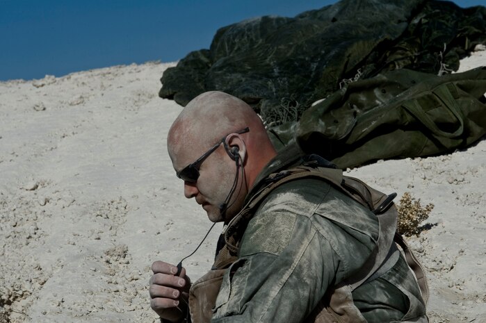 A U.S. Air Force independent duty medical technician, 58th Rescue Squadron, simulates the role of a downed pilot during a combat training mission Jan. 18, 2012, at the Nevada Test and Training Range. Pararescuemen are trained to provide emergency medical treatment to downed pilots and other injured personnel in adverse terrain and conditions during combat or peacetime. (U.S. Air Force photo by Airman 1st Class Daniel Hughes/Released)