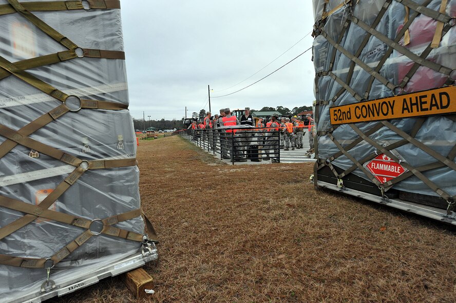 SAVANNAH AIR NATIONAL GUARD BASE, Ga. – Airmen from the 52nd Combat Communications Squadron rally for a safety briefing before loading cargo pallets for a convoy to their field training exercise location here Jan. 24. The unit began its Arctic Gator field training exercise Jan. 24 and will build, operate in and defend a fully functioning bare base communications camp before the exercise ends Feb. 3. (U.S. Air Force photo by Tommie Horton)