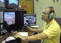 Len Kight, 14th Operations Support Squadron civilian simulator
instructor, demonstrates a flight simulator technique in Bldg. 738 at Joint
Base San Antonio-Randolph Jan. 24. Kight is on temporary duty
assignment to Randolph from Columbus Air Force Base, Miss. to help augment
12th Operations Support Squadron simulator instructors after the
consolidation of the Introduction to Fighter Fundamentals training course.
(U.S. Air Force photo/Joel Martinez)

