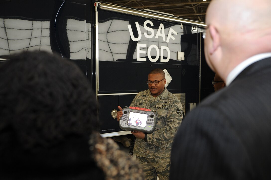 Staff Sgt. Michael Dove, NCO in charge of Explosive Ordnance Disposal Operations, displays and discusses the control panel for the FF-6 and HD-2 robots during a tour for honorary commanders here Jan 20. The honorary commanders were given a tour of the base, which was designed to highlight Andrews assets and its missions to civic leaders and to form positive relationships with the local community. (U.S. Air Force photo/Staff Sgt. Matt Coleman-Foster)