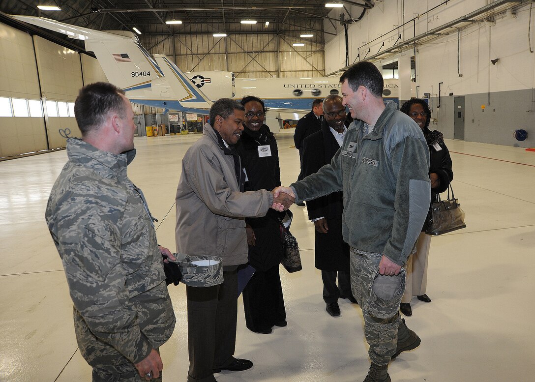 Col. Ken Rizer and Col. Greg Urtso, 11th Wing/Joint Base Andrews wing and vice commanders, greet the JBA honorary commanders during their tour of the base Jan 20. The honorary commanders were given a tour of the base, which was designed to highlight Andrews assets and its missions to civic leaders and to form positive relationships with the local community. (U.S. Air Force photo/Staff Sgt. Matt Coleman-Foster)