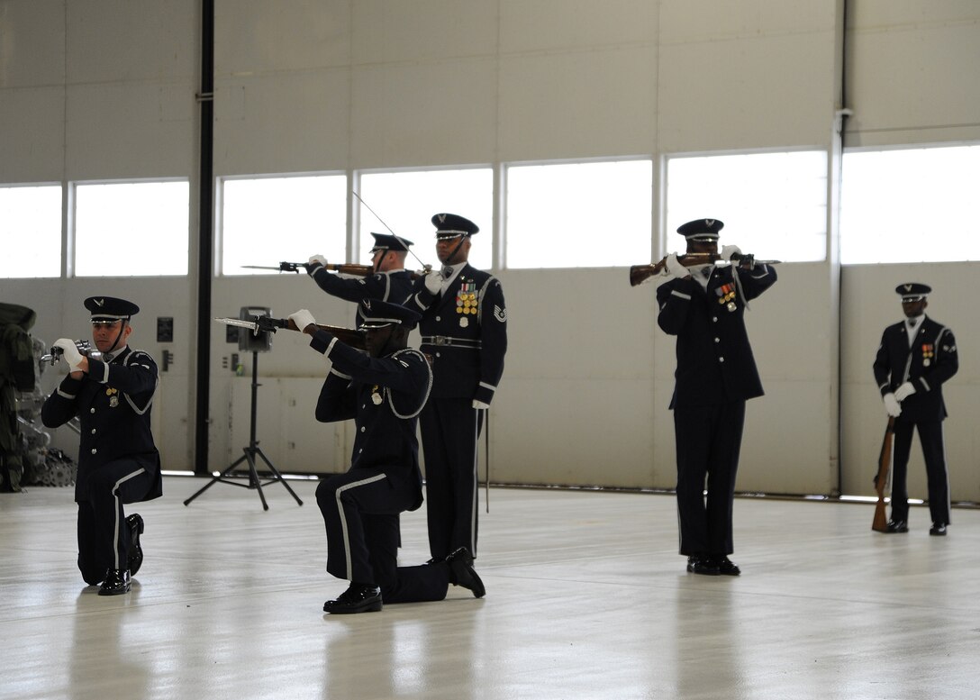 Members of the United States Air Force Honor Guard Drill Team perform maneuvers with skill and precision before a host of Joint Base Andrews Honorary Commanders during a tour of Andrews Jan 20. The tour was designed to highlight Andrews assets to civic leaders and to form positive relationships with the local community. (U.S. Air Force photo/Staff Sgt. Matt Coleman-Foster)