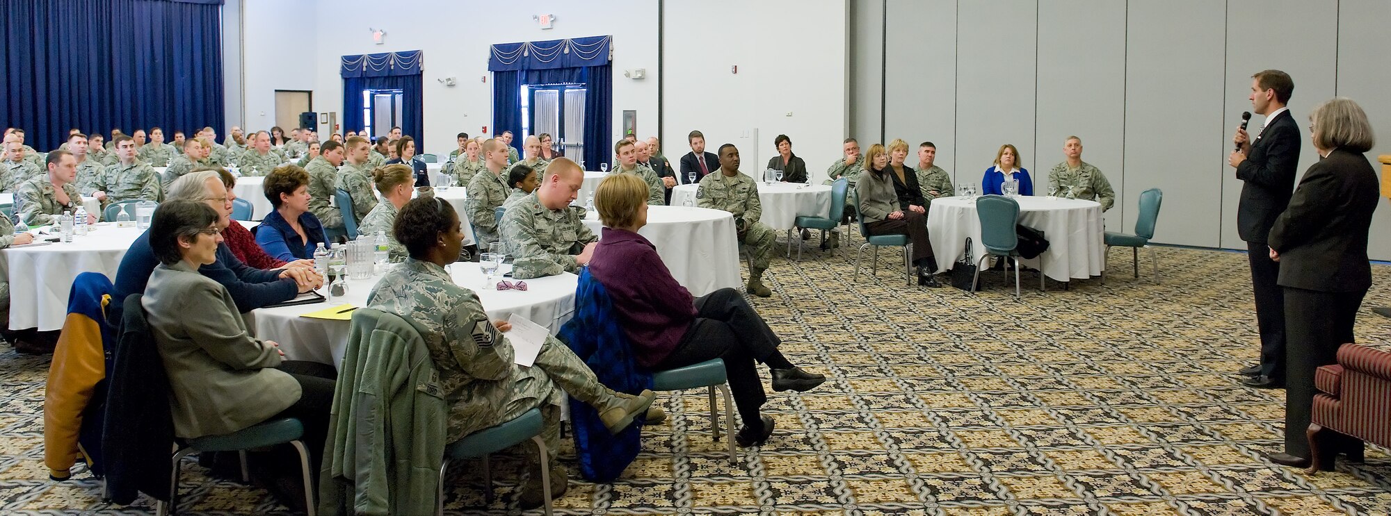 Holly Petraeus, director of the Consumer Financial Protection Bureau's Office of Servicemembers Affairs, and Delaware Attorney General Beau Biden speak with members of Team Dover during a town hall meeting, Jan. 20, 2012, at The Landings Club at Dover Air Force Base, Del. They also met with local media during a press conference and base leadership at a round table dialogue to discuss financial and consumer issues including housing, for-profit schools, used car lots, loans, debt collection and the Servicemembers Civil Relief Act. (U.S. Air Force photo by Roland Balik)