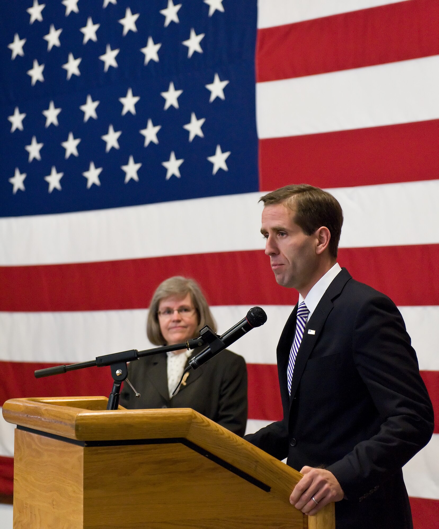 Delaware Attorney General Beau Biden, right, stands with Holly Petraeus, director of the Consumer Financial Protection Bureau’s Office of Servicemember Affairs, at a press conference Jan. 20, 2012, at The Landings Club at Dover Air Force Base, Del. They also met with base leadership during a round table dialogue and hosted a town hall meeting with Airmen from Dover AFB to discuss issues including housing, for-profit schools, used car lots, loans, debt collection and the Servicemembers Civil Relief Act. (U.S. Air Force photo by Roland Balik)