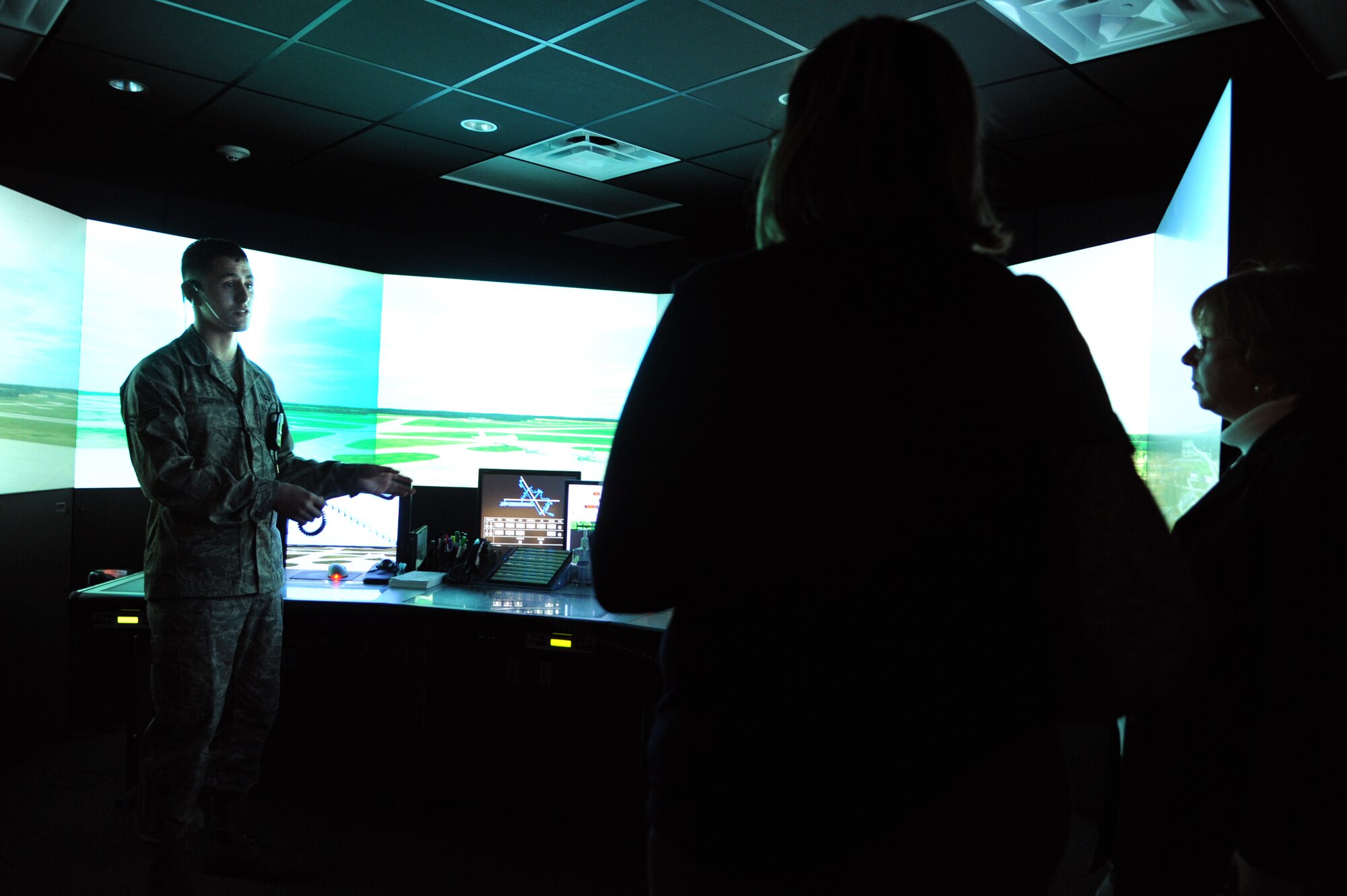 Senior Airman Keoni Kuapahi, an air traffic controller with the 436th Operations Group, showcases the capabilities of the air traffic control simulator during the base's first Military 101 for Educators Tour Jan. 19, 2012, at Dover Air Force Base, Del. Educators from across Kent County, Del., came to Dover AFB to familiarize themselves with base programs meant to benefit military children. (U.S. Air Force photo By Master Sgt. Jeanette Spain)