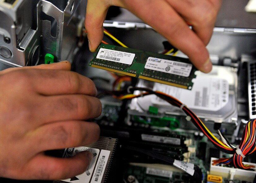 Memory is removed from a hard drive Jan. 19, 2012 at Dover Air Force Base,
Del. This process is common when troubleshooting service members' computers. (U.S. Air Force photo by Tech. Sgt. Chuck Walker)