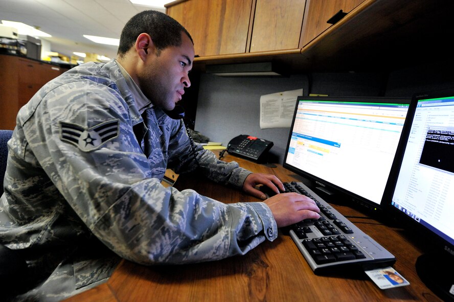 Senior Airman Jason McKenzie, client systems technician from the 436th
Communications Squadron, troubleshoots a computer issue by remotely logging
into a customer's computer Jan. 19, 2012, at Dover Air Force Base, Del. (U.S. Air Force photo by Tech. Sgt. Chuck Walker)