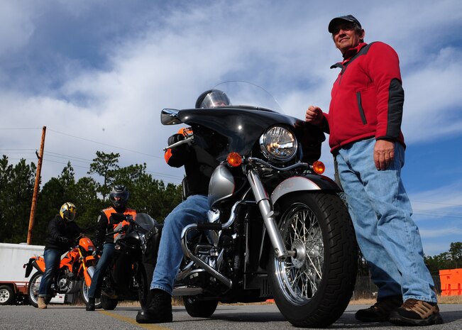 Skip Evans prepares students prior to performing their next move during the Basic Rider Course at Joint Base Charleston - Weapons Station, Jan. 19. The motorcycle course allows riders to become more competent with their bike in a controlled environment which is significantly safer than public roads. Evans is a rider coach with Cape Fox, a contractor for the Air Force Installation’s Motorcycle Safety Programs (U.S. Air Force photo/Staff Sgt. Katie Gieratz)(RELEASED)
