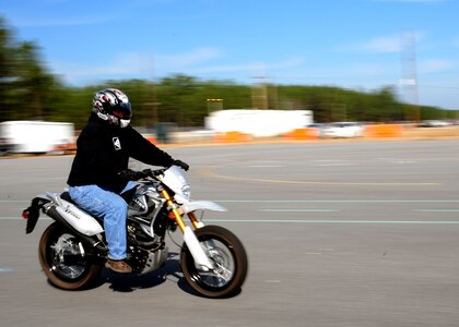 John Harriger performs a move during the Basic Rider Course at Joint Base Charleston - Weapons Station, Jan. 19. There are three courses provided to JB Charleston personnel; the basic rider course, a refresher course and a military sport bike course. More than 35 students attend the courses each month. Harriger is a fire alarm shop supervisor with the 628th Civil Engineer Squadron. (U.S. Air Force photo/Staff Sgt. Katie Gieratz)(RELEASED)
