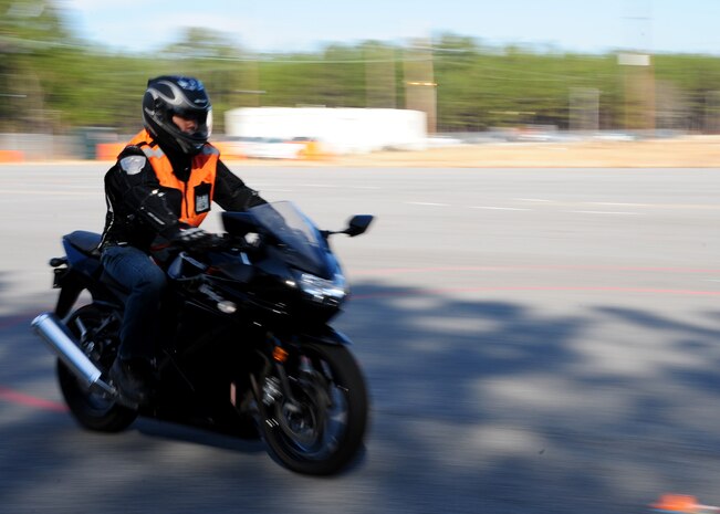 Senior Airman Lakan Ello prepares to perform his next move during the Basic Rider Course at Joint Base Charleston - Weapons Station, Jan. 19. The motorcycle course allows riders to become more competent with their bike in a controlled environment which is significantly safer than public roads. Ello is a services journeyman with the 628th Force Support Squadron. (U.S. Air Force photo/Staff Sgt. Katie Gieratz)(RELEASED)

