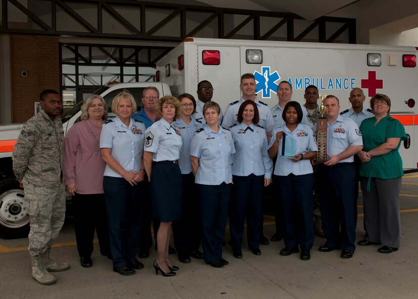 Members of the 23d Medical Group pose for a photo outside of the medical group main entrance at Moody Air Force Base, Ga., Jan. 23, 2012. The unit was recently selected as the 2011 Air Combat Command Best Clinic of the Year for their professionalism and hard work in health services, patient care and beneficiary support. (U.S. Air Force photo by Senior Airman Eileen Meier/Released)