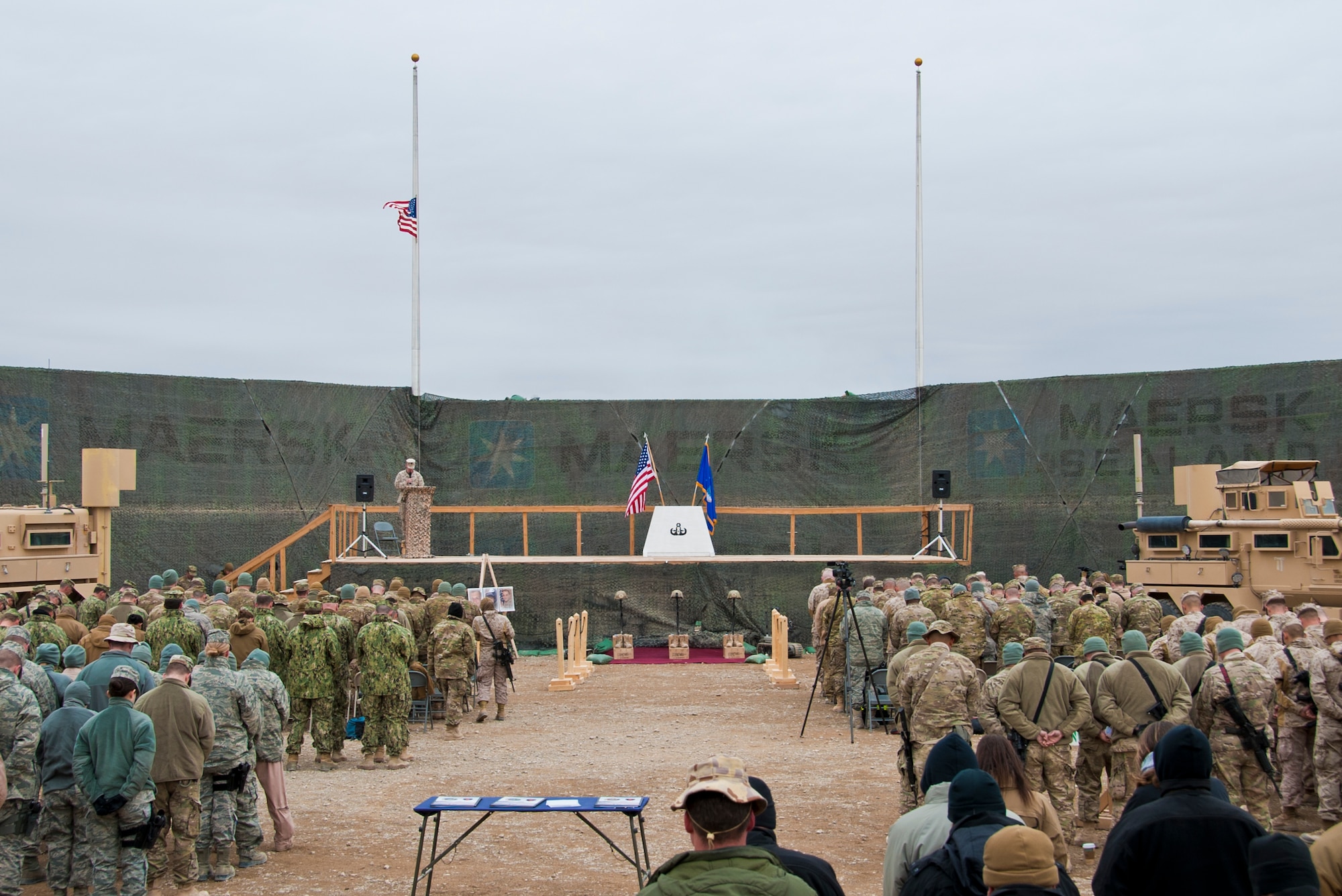 CAMP LEATHERNECK, Afghanistan -- About 100 Airmen, Soldiers, Sailors and Marines observe a moment of silence during a memorial ceremony at Camp Leatherneck, Afghanistan Jan. 24, 2012. The memorial ceremony honored three explosive ordnance disposal Airmen killed by an improvised explosive device in Shir ghazi, Helmand province, Afghanistan. (U.S. Air Force photo by Staff Sgt. David Carbajal)