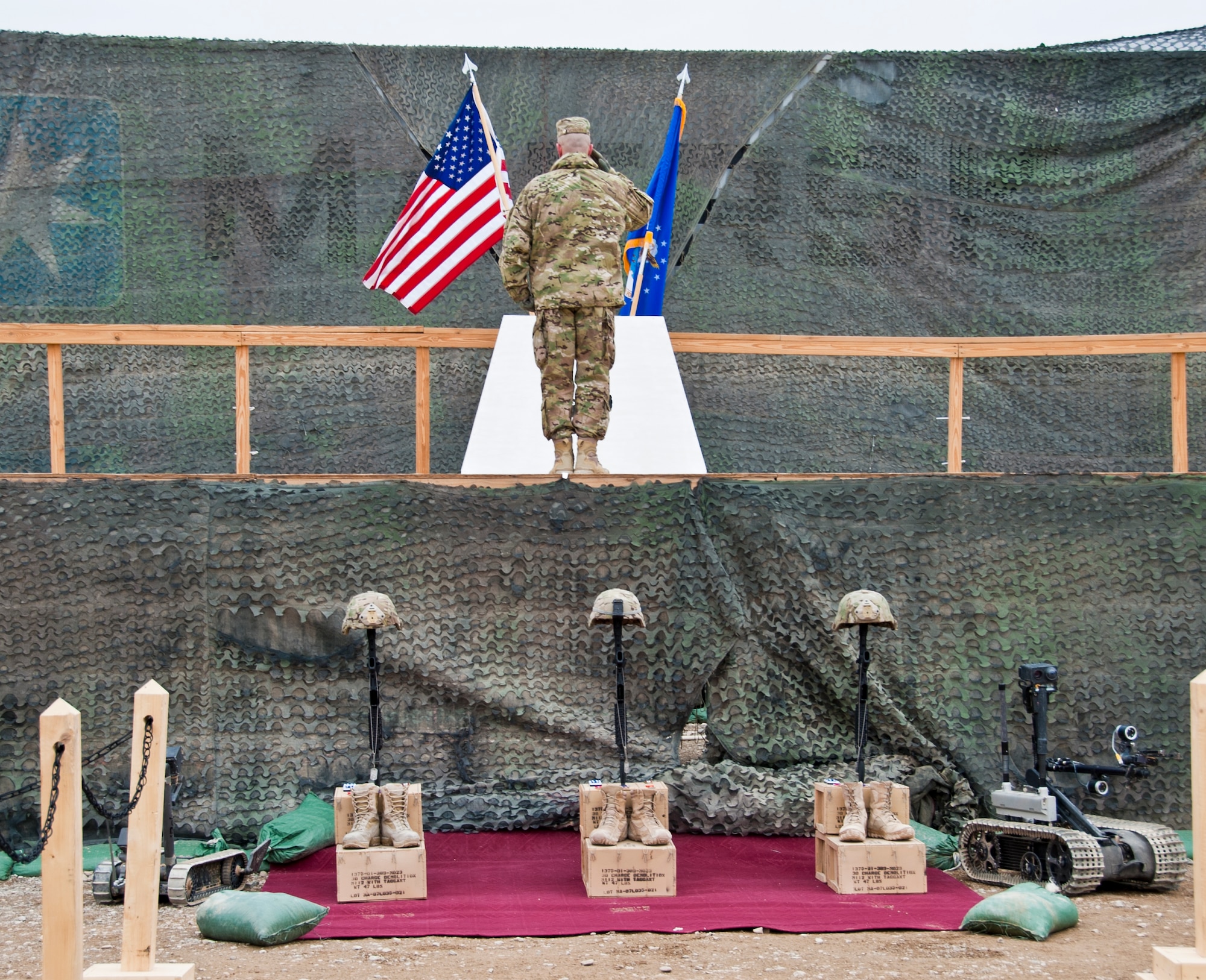 CAMP LEATHERNECK, Afghanistan -- Senior Master Sgt. Christopher Schott, Combined Joint Task Force Paladin explosive ordnance disposal flight chief, renders a salute to the EOD memorial during a memorial ceremony at Camp Leatherneck, Afghanistan Jan. 24, 2012. The memorial ceremony honored three EOD Airmen killed by an improvised explosive device in Shir ghazi, Helmand province, Afghanistan. (U.S. Air Force photo by Staff Sgt. David Carbajal)