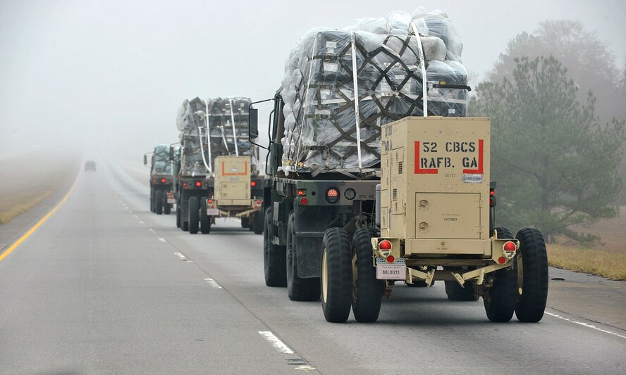 SAVANNAH AIR NATIONAL GUARD BASE, Ga. — Three 52nd Combat Communications Squadron’s light medium tactical vehicles with trailer mounted generators roll down Route 16 in Georgia Jan. 23. The unit began its “Arctic Gator” field training exercise Jan. 24 and will build, operate in and defend a fully functioning bare base communications camp before the exercise ends Feb. 3. (U.S. Air Force photo by Tommie Horton)
