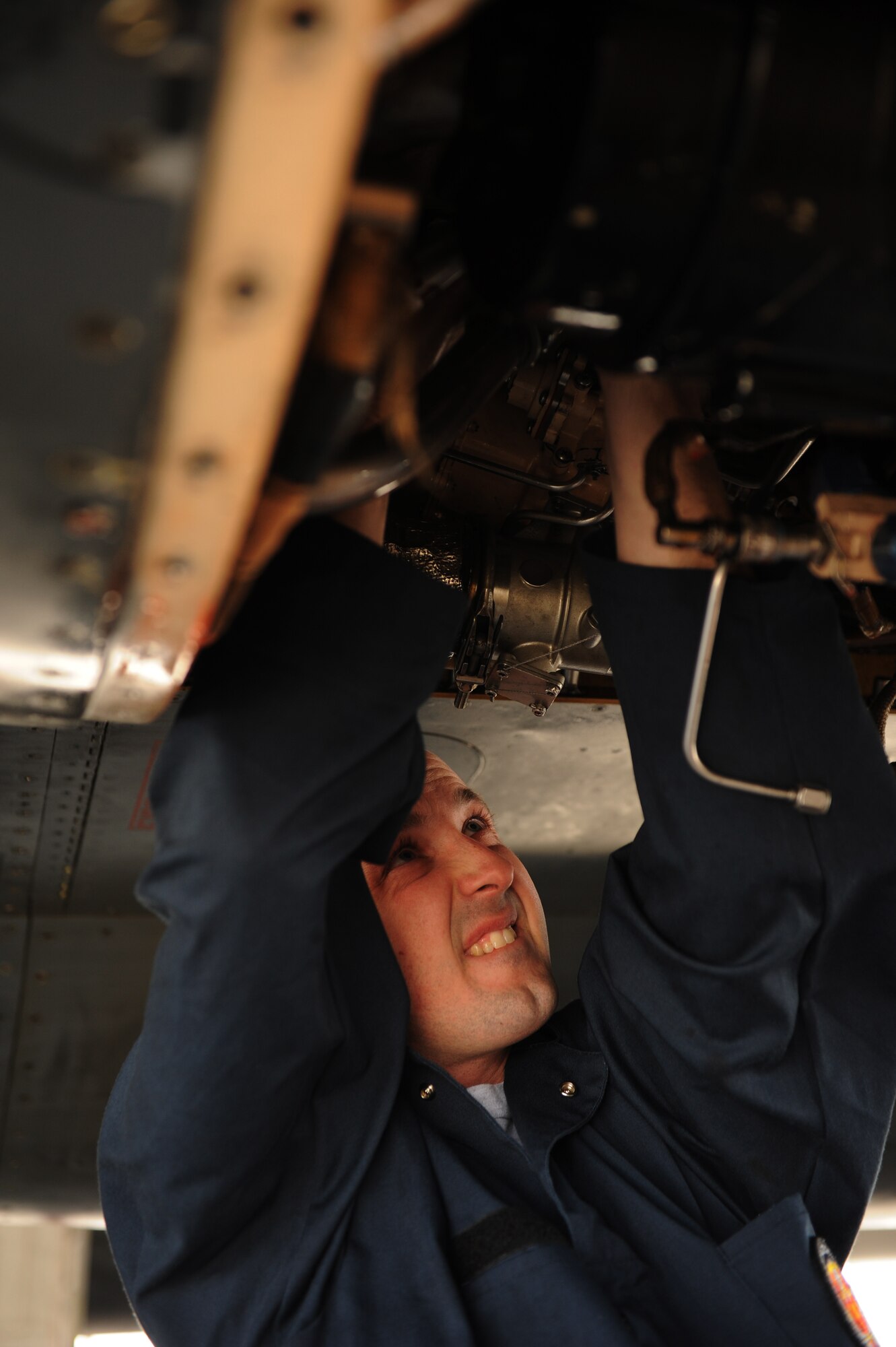 SOUTHWEST ASIA – Staff Sgt. Brian Harrison, 379th Expeditionary Maintenance Squadron Fabrication Flight sheet metals technician, attaches a new piece of pressure line to a hydraulic system inside a B-1B Lancer here Jan. 21, 2012. The new piece was custom-made by Harrison and Staff Sgt. Jason Hayden. Harrison is a native of Minneapolis and is deployed from Ellsworth Air Force Base, S.D. (U.S. Air Force photo/Staff Sgt. Nathanael Callon)