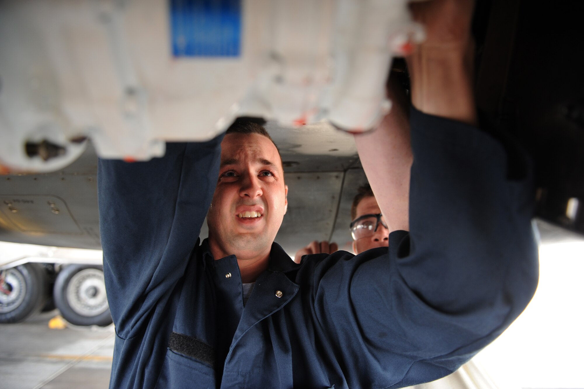 SOUTHWEST ASIA – Staff Sgt. Brian Harrison, 379th Expeditionary Maintenance Squadron Fabrication Flight sheet metals technician, fits a new piece of pressure line on a hydraulic system inside a B-1B Lancer here Jan. 21, 2012. The new piece was custom-made by Harrison and Staff Sgt. Jason Hayden. Harrison is a native of Minneapolis and is deployed from Ellsworth Air Force Base, S.D. (U.S. Air Force photo/Staff Sgt. Nathanael Callon)
