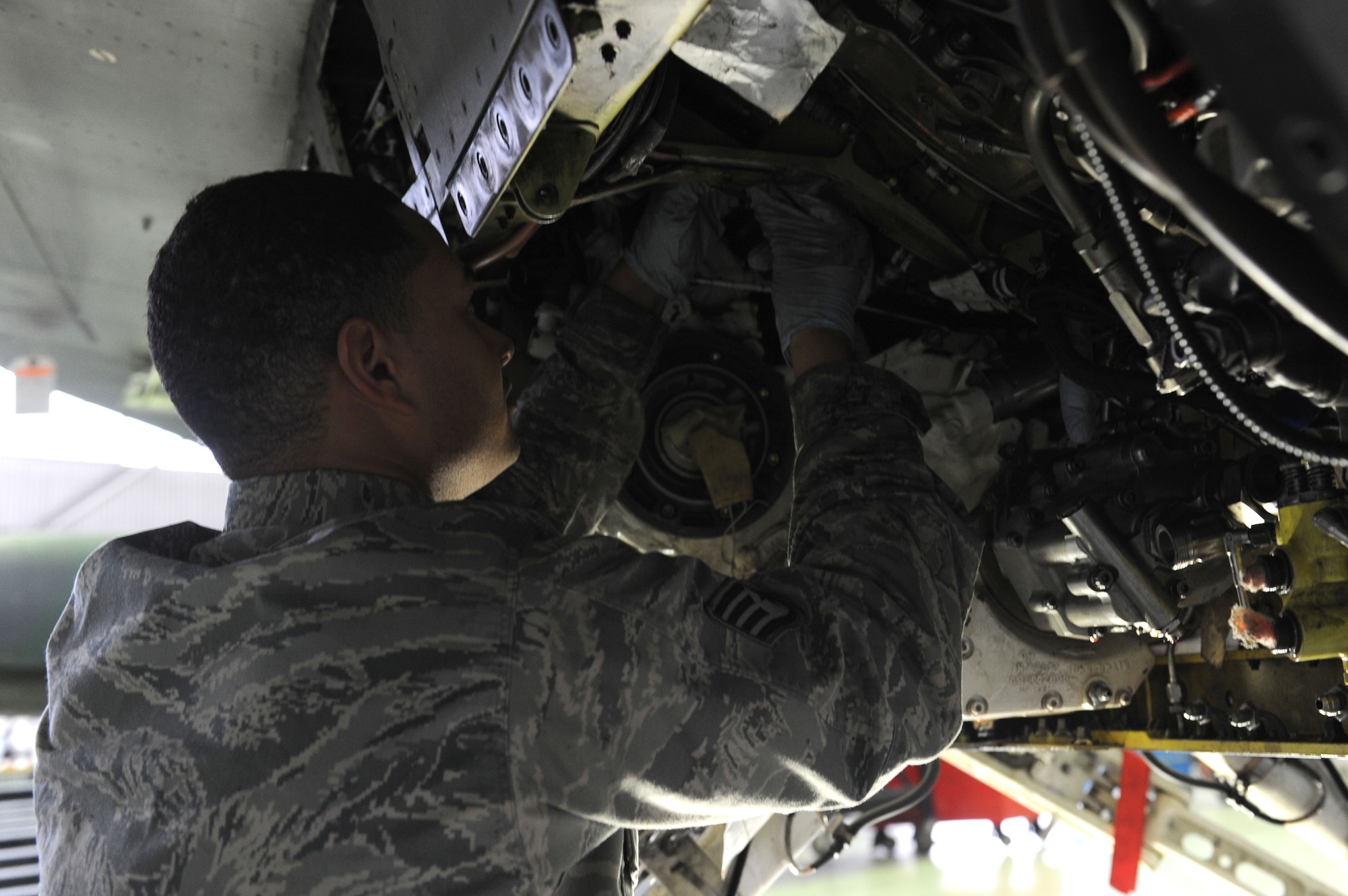 SPANGDAHLEM AIR BASE, Germany – Staff Sgt. Ray Frederick, 52nd Aircraft Maintenance Squadron electric environmental technician, re-routes a wire harness during maintenance on an F-16 Fighting Falcon in Hangar 2 here Jan. 23. Airmen perform maintence daily with different aircraft rotations to ensure the health of the 52nd Fighter Wing fleet. Frederick works to provide the wing mission-capable aircraft through scheduled maintenance as part of the 480th Aircraft Maintenance Unit. (U.S. Air Force photo/Senior Airman Christopher Toon)