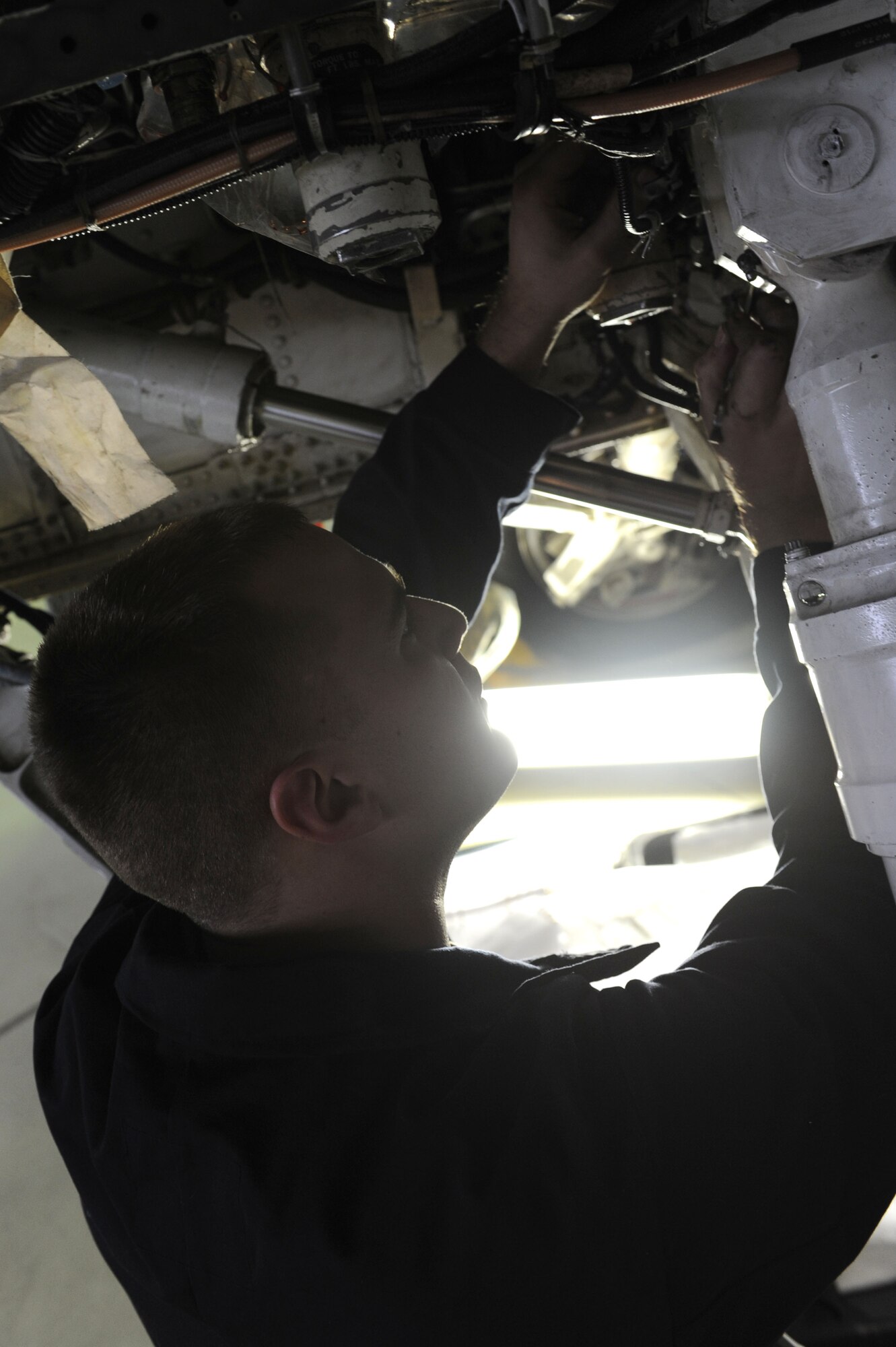 SPANGDAHLEM AIR BASE, Germany – Senior Airman Michael Wylie, 52nd Aircraft Maintenance Squadron tactical aircraft maintainer, installs a hydraulic manifold line on an F-16 Fighting Falcon during maintence in Hangar 2 here Jan 23. Airmen perform maintence daily with different aircraft rotations to ensure the health of the 52nd Fighter Wing fleet. Wylie works to provide the wing mission-capable aircraft through scheduled maintenance as part of the 480th Aircraft Maintenance Unit. (U.S. Air Force photo/Senior Airman Christopher Toon)