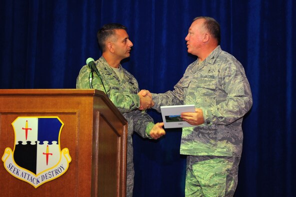 SPANGDAHLEM AIR BASE, Germany – Col. David Julazadeh, left, 52nd Fighter Wing vice commander, gives a book to Chaplain (Col.) G. Scott Henry, U.S. Air Forces in Europe command chaplain, as a token of appreciation for the chaplain’s part in this year’s National Prayer Luncheon inside the Brick House here Jan. 20. The National Prayer Breakfast began in 1953 as a way to recognize the values upon which America was founded. The current ceremony highlights these values and promotes a shared sense of spiritual empowerment within communities. (U.S. Air Force photo/Airman 1st Class Dillon Davis)