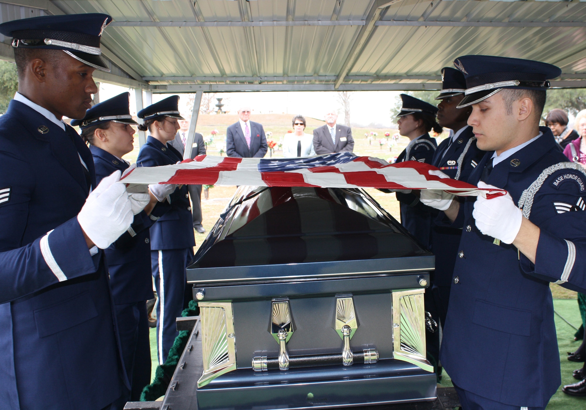 Barksdale Honor Guard Airmen begin a six-man flag folding sequence at a funeral in Houghton, La., Jan. 16. Handpicked to serve, Honor Guard Airmen train hard on a daily basis to ensure every movement they make is professional and precise, and dignifies the event for which they are detailing. (Courtesy photo)(RELEASED)