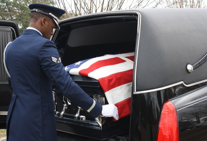 Senior Airman Princeton Drake, Barksdale Honor Guard Bravo Flight leader, prepares the flag and casket for a pallbearer sequence at a funeral in Houghton, La., Jan. 16. Drake was part of a six-man Honor Guard team for the funeral. (Courtesy photo)(RELEASED)