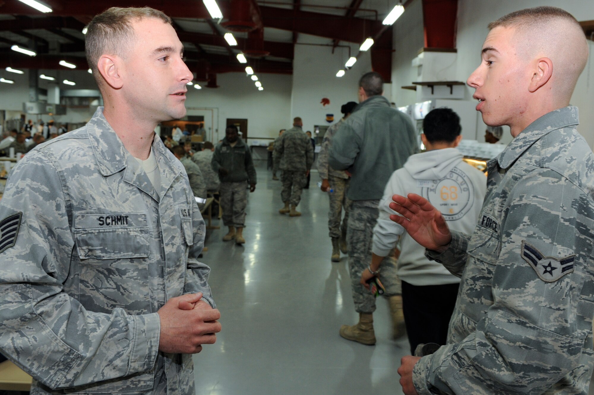 Tech. Sgt. Brian Schmitt, 332nd Expeditionary Medical Group, solicits for volunteers during a bone marrow drive in the Huntley Dining Facility at an undisclosed location in Southwest Asia, Jan. 22, 2012. Schmitt and fellow 332nd EMDG members held the drive during meal times to get as much participation as possible. Schmitt is deployed from Spangdahlem Air Base, Germany and is a native of Rogers, Ark. (U.S. Air Force photo by Staff Sgt. Joshua J. Garcia/Released)