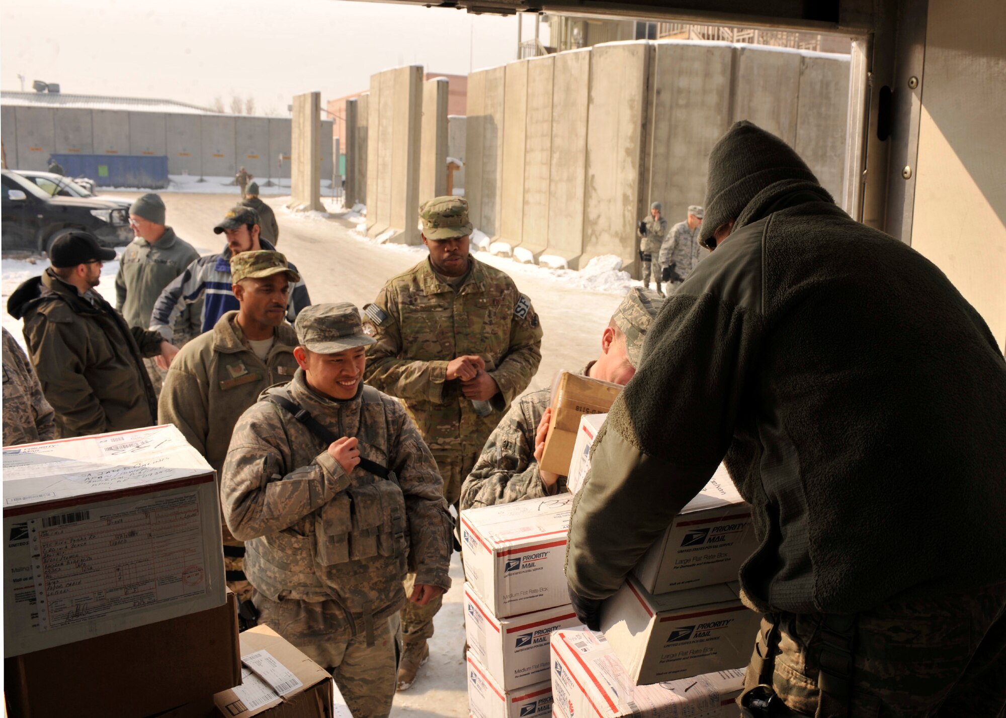 BAGRAM AIRFIELD, Afghanistan— Staff Sgt. Jennifer Albitz distributes mail to members of Security Forces at Bagram Airfield, Afghanistan, Jan. 24, 2012. Albitz is the assistant noncommissioned officer in charge of the Air Force Mail Distribution Center and is deployed from Whiteman Air Force Base, Mo. (U.S. Air Force photo/ Airman 1st Class Ericka Engblom)