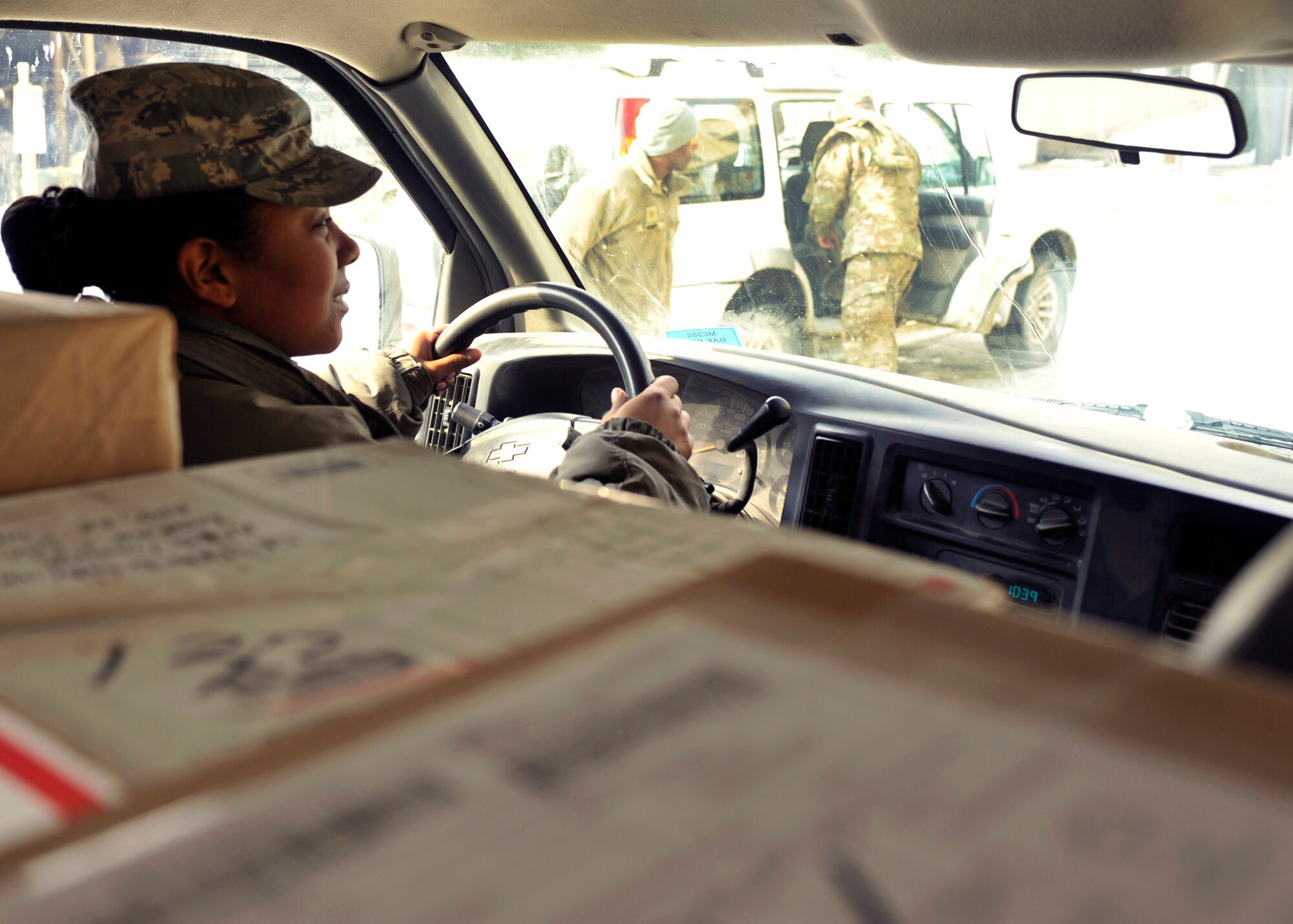 BAGRAM AIRFIELD, Afghanistan— Staff Sgt. Elyshia Moore maneuvers the postal delivery truck through the streets at Bagram Airfield, Afghanistan, Jan. 24, 2012. Moore is the noncommissioned officer in charge of the Air Force Mail Distribution Center and is deployed from Ramstein Air Base, Germany. (U.S. Air Force photo/ Airman 1st Class Ericka Engblom)