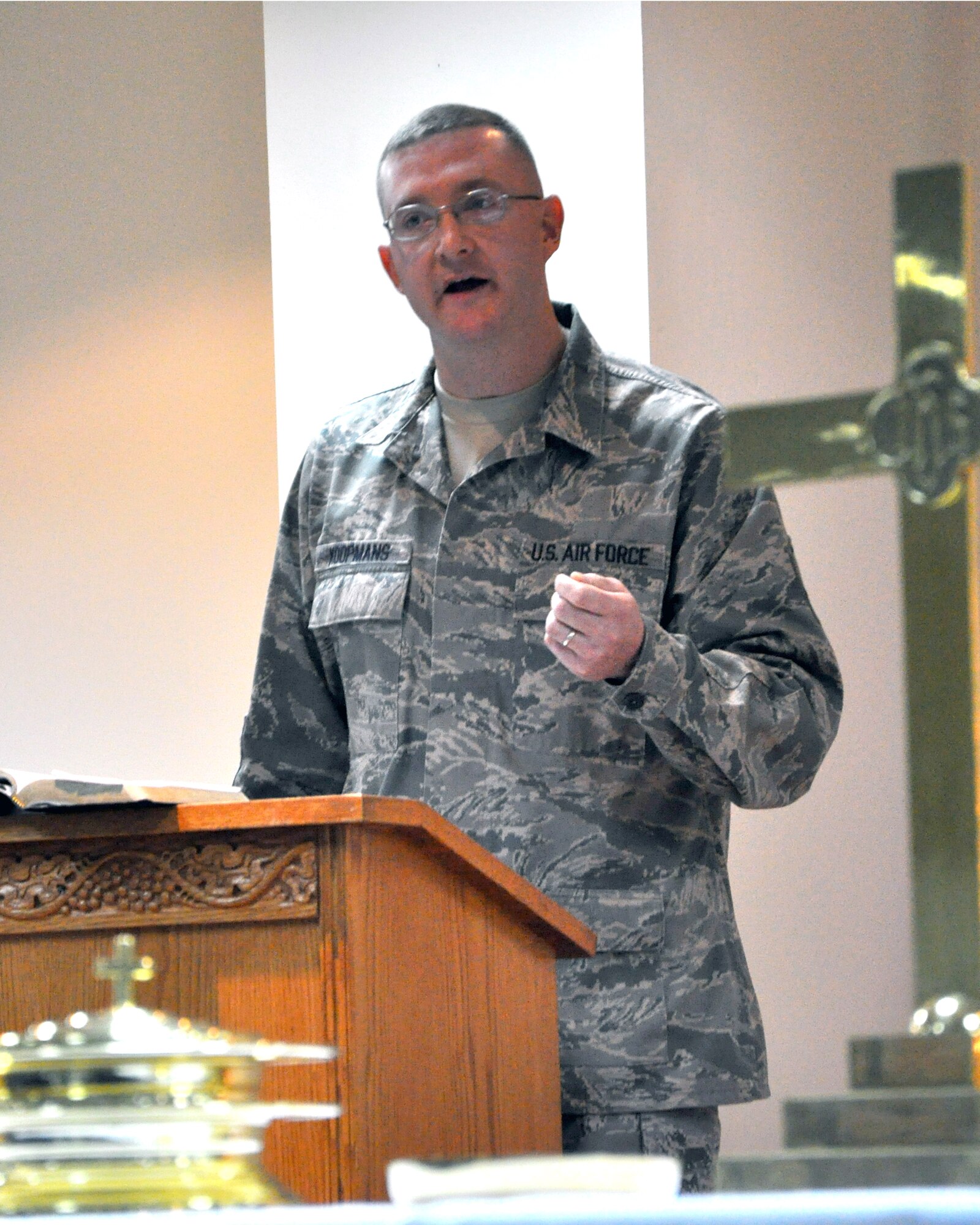 Master Sgt. Christopher Koopmans, 386th Expeditionary Logistic Readiness Squadron’s Air Terminal Operation Center senior controller, tries his hand at sermonizing to a congregation at The Rock Jan. 1, 2012, as he works toward becoming an Air Force chaplain.  Koopmans, a reservist based at Carswell Air Force Base, Texas, works closely with the 386th Air Expeditionary Wing Chapel while deployed, on his way to completing a Master's of Divinity degree. (U.S. Air Force photo/Tech Sgt. Stacy Fowler)