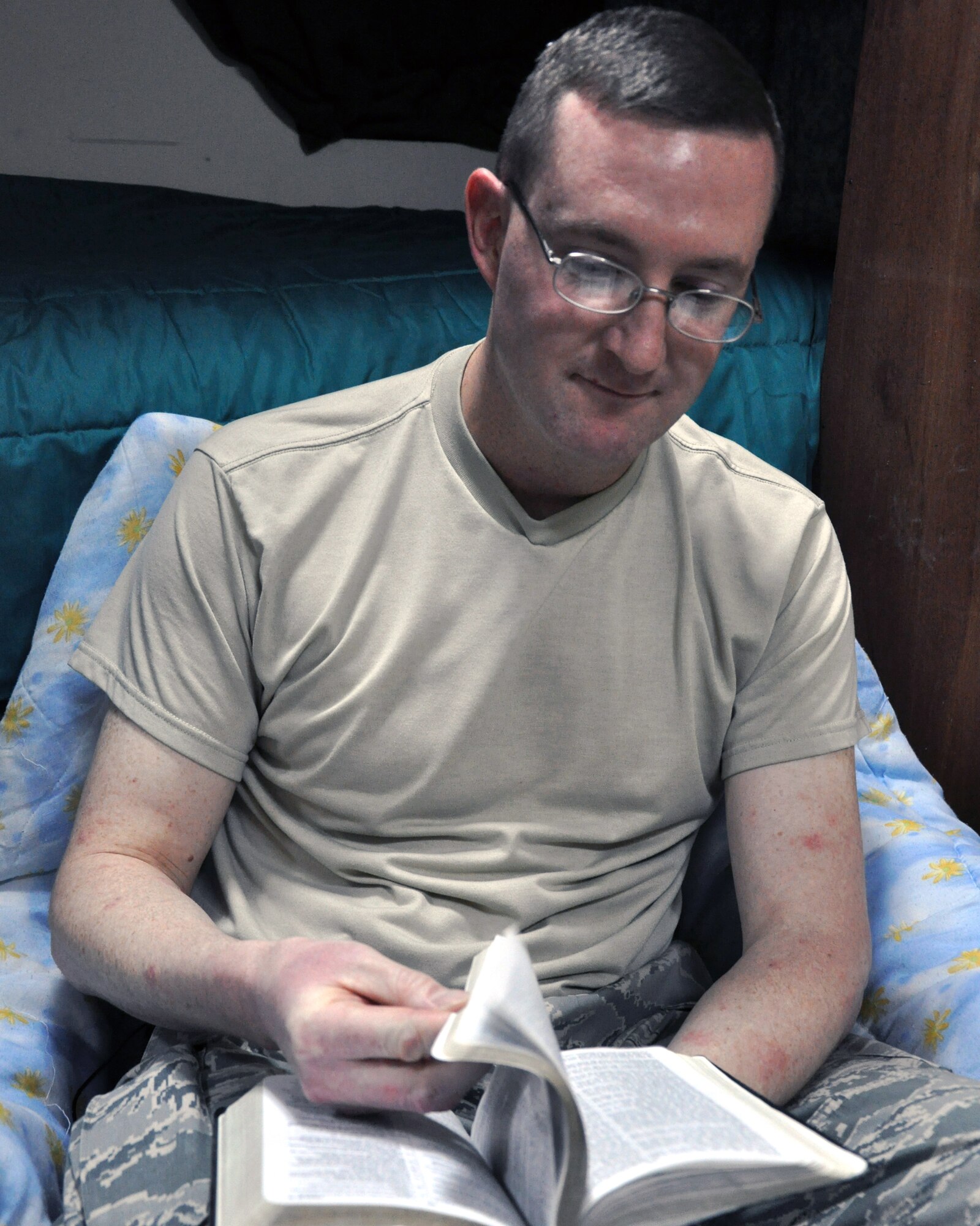 Master Sgt. Christopher Koopmans, 386th Expeditionary Logistic Readiness Squadron’s Air Terminal Operation Center senior controller, reads scripture from the Bible during his studies toward becoming an Air Force chaplain Dec. 30, 2011.  Koopmans, a reservist based at Carswell Air Force Base, Texas, has been studying to be a chaplain for about three years.  He left active duty service and became a reservist to devote his time to reaching his dreams of becoming a man of God. (U.S. Air Force photo/Tech Sgt. Stacy Fowler)