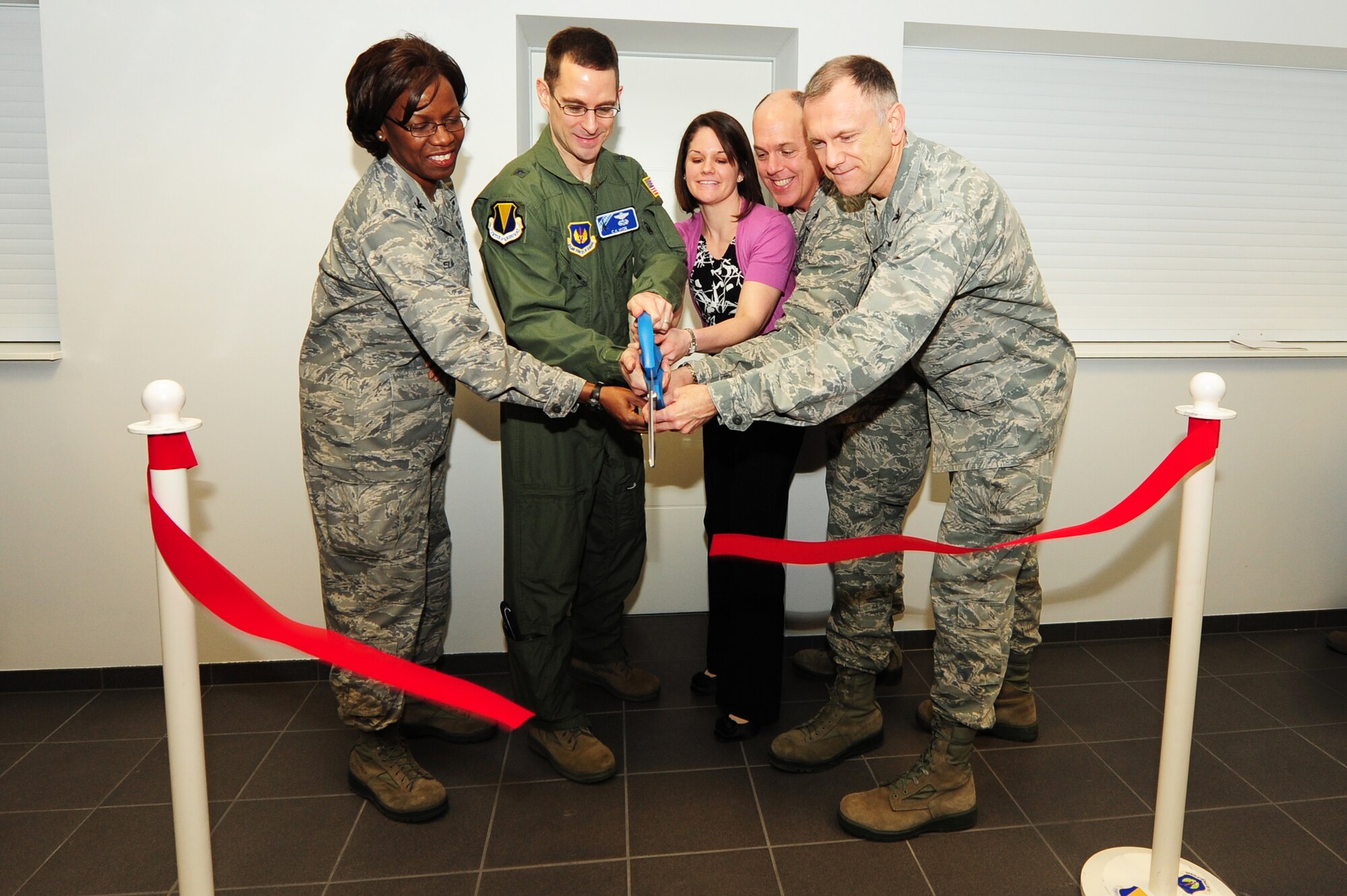 Col. Joycelyn Elaiho, 86th Medical Group commander, Brig. Gen C.K. Hyde, 86th Airlift Wing commander, Morgan McNabb, Drug Demand Reduction programmer, Col. John Shapland, 435th Air Ground Operations Wing commander, and Col. Daniel Reiser, 86th Medical Operation Squadron commander, cut the ribbon at the opening of the new DDR facility, Ramstein Air Base, Germany, Jan. 24, 2012. The new DDR facility took six months to complete and is located in the South Side Fitness Center Annex. (U.S. Air Force photo by Senior Airman Aaron-Forrest Wainwright)