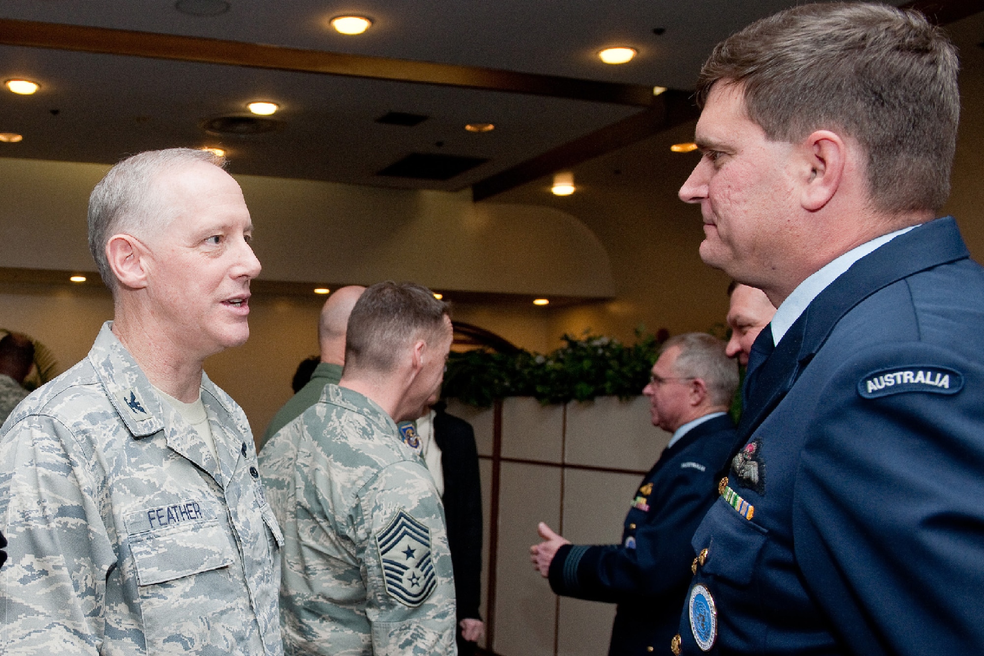 YOKOTA AIR BASE, Japan -- (left to right) Col. Otto Feather, 374th Airlift Wing commander, greets Royal Australian Air Force Group Captain Luke Stoodley, United Nations Command (Rear) commander, after the UNC (Rear) change of command ceremony at Yokota Air Base, Japan, Jan. 24, 2012. The United Nations Command's principal representative in Japan, the UNC (Rear) maintains the status of forces agreement regarding United Nations Forces in Japan during armistice conditions.  (U.S. Air Force photo/Osakabe Yasuo)