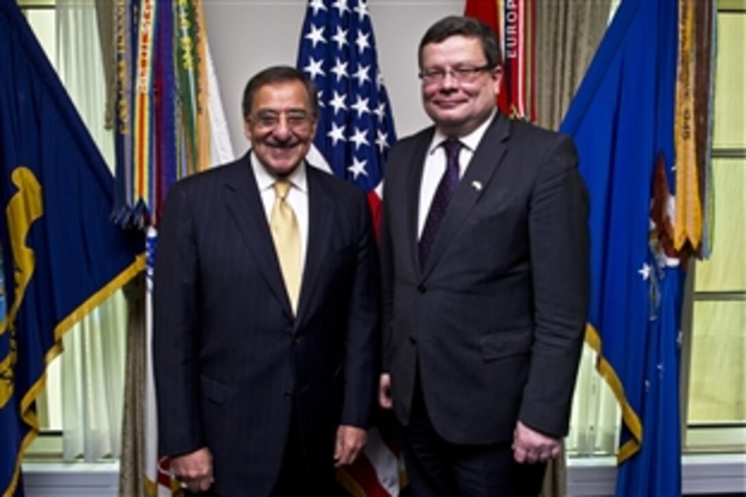 U.S. Defense Secretary Leon E. Panetta, left, welcomes Czech Defense Minister Alexandr Vondra to the Pentagon, Jan. 24, 2012. Panetta and Vondra met to discuss bilateral defense issues.