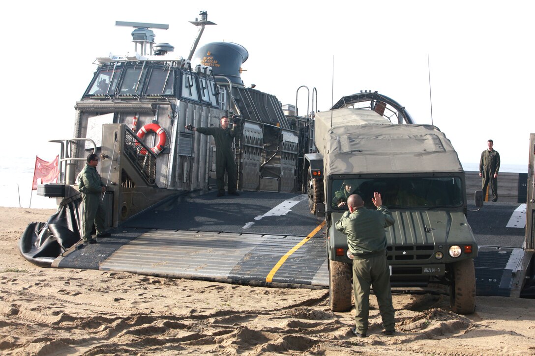 Japanese soldiers drive their tactical vehicles aboard a Landing Craft Air Cushion during a familiarization exercise at Camp Pendleton, Calif., Jan. 24. The event was part of Exercise Iron Fist 2012, a bilateral amphibious training exercise between U.S. Marines and the Japanese Ground Self Defense Force.