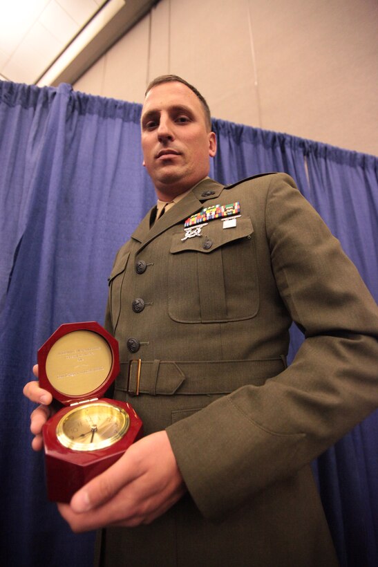 Capt. Gregory A. Lizak, assistant communications officer, 13th Marine Expeditionary Unit, I Marine Expeditionary Force, was awarded the 2011 Copernicus Award from members of the Armed Forces Communications and Electronics Association (AFCEA) during a ceremony at the San Diego Convention Center, Jan. 24. He received the award for his execution and innovation of San Antonio Class (LPD-17) ship communication advancements, Marine Corps Air-Ground Task Force broadband communications and advance over-the-horizon narrowband communications. The name for the award came from the Copernicus Architecture used as the blueprint for the future C4I structure of the Navy. (Official U.S. Marine Corps photo by Sgt. Christopher O’Quin/Released)::r::::n::