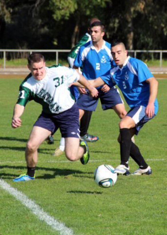 The USS Bataan soccer team, comprised of Marines and sailors with the 22nd Marine Expeditionary Unit and USS Bataan, play soccer against a Portuguese team during a Lisbon, Portugal, port visit, Jan. 24, 2012. The Marines and sailors of the 22nd MEU are currently deployed with Amphibious Squadron 6 aboard the USS Bataan Amphibious Ready Group.