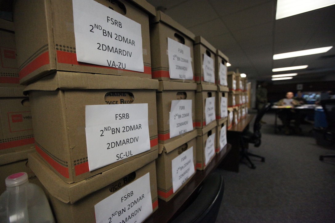 Boxes of service record books are stacked in the SRB section, Installation Personnel Administration Center aboard Marine Corps Base Camp Lejeune after recently being scanned and digitalized. More than 38,000 SRBs were scanned during the conversion to an electronic record, which is now available on Marine Online.::r::::n::