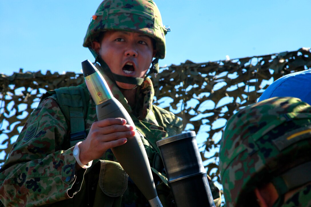 A soldier with the Japanese Ground Self Defense Force employs an 81 mm mortar at Range 222 on Camp Pendleton, Jan. 25. The 5-day evolution was a part of Exercise Iron Fist 2012, a bilateral training opportunity for the 15th Marine Expeditionary Unit and the JGSDF.