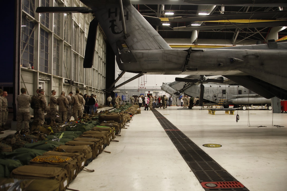 Marines from Marine Heavy Helicopter Squadron 366 say goodbye to their families and friends in the squadron's hangar Jan. 25, 2012. The squadron departed for a seven-month deployment to Afghanistan, where they will support Operation Enduring Freedom.