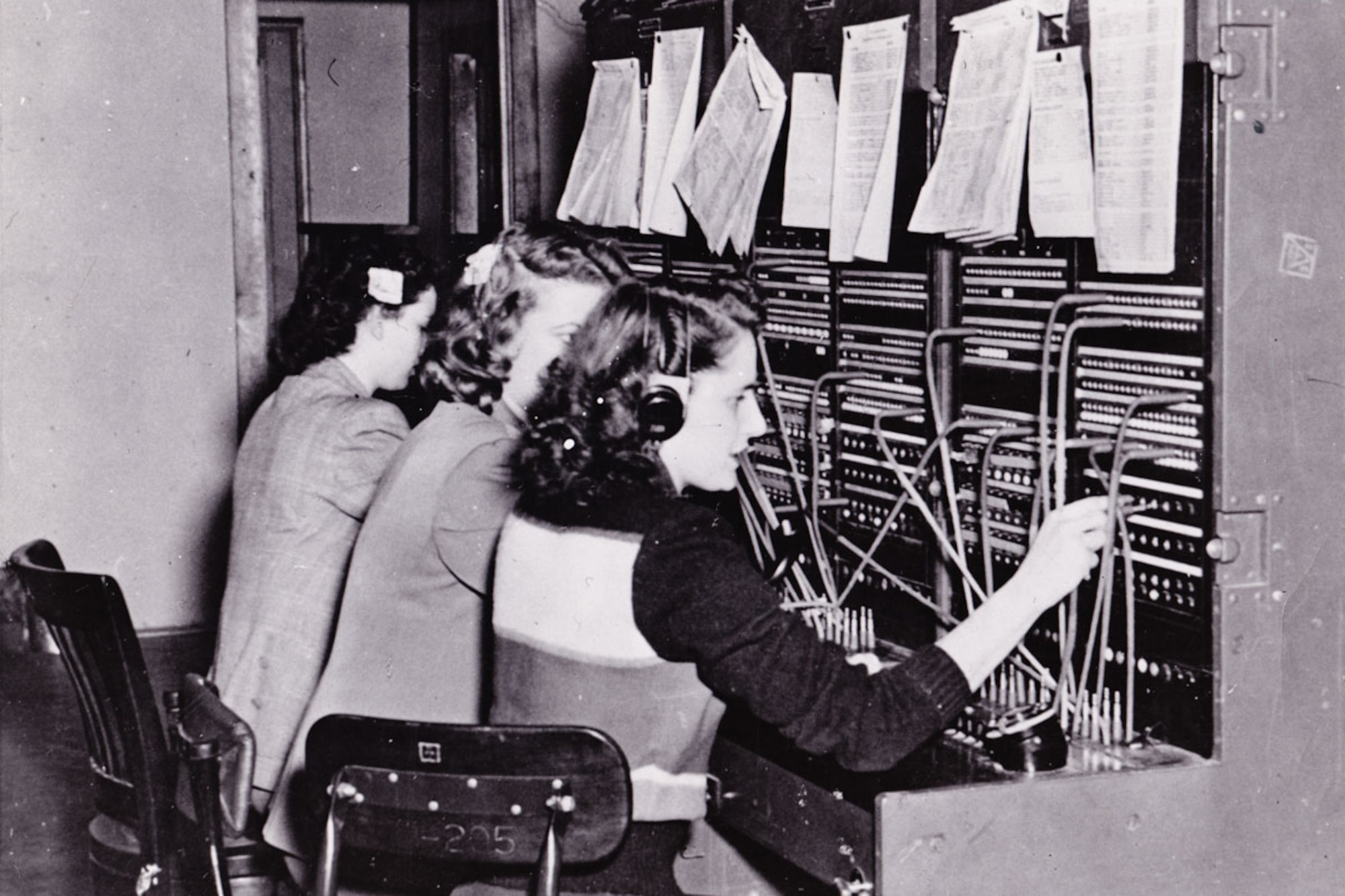 Fort Richardson telephone operators Hilda Dahler, Arlys Berggren and Ruthie Duguid connect calls in 1950. The operators use the fort’s first switchboard, which was based on a field tactical model. (U.S. Army file photo)