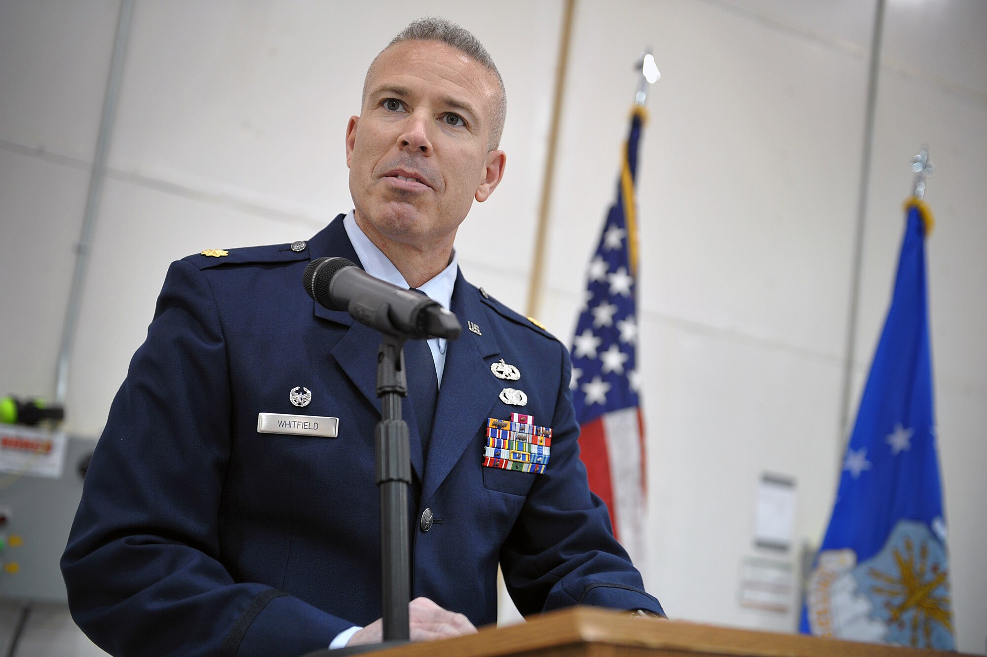Maj. Bernabe Whitfield speaks to audience members as he accepts command of the 27th Special Operations Maintenance Squadron during an official squadron reorganization ceremony at Cannon Air Force Base, N.M., Jan. 24, 2012. (U.S. Air Force photo Tech. Sgt. Josef Cole)
