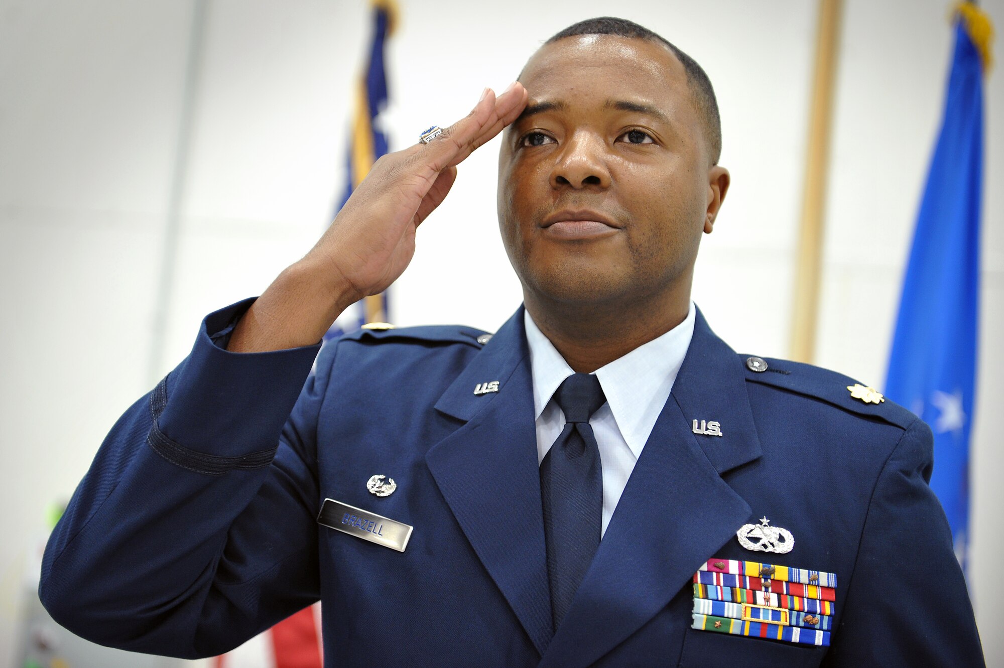 Maj. Marcus Brazell salutes his squadron as he accepts command of the 727th Special Operations Aircraft Maintenance Squadron during an official squadron reorganization ceremony at Cannon Air Force Base, N.M., Jan. 24, 2012. (U.S. Air Force photo Tech. Sgt. Josef Cole)