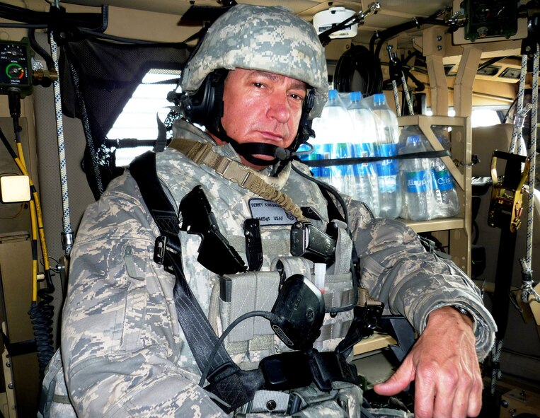 TRAVIS AIR FORCE BASE, Calif. -- Chief Master Sgt. Terry L. Kirkbride, 349th Maintenance Squadron Superintendent, shown here in his mine resistant ambush protected vehicle (MRAP), ready to go out on convoy with his U.S. Army team, is the acting 349th Air Mobility Wing Command Chief Master Sergeant. (U.S. Air Force courtesy photo)