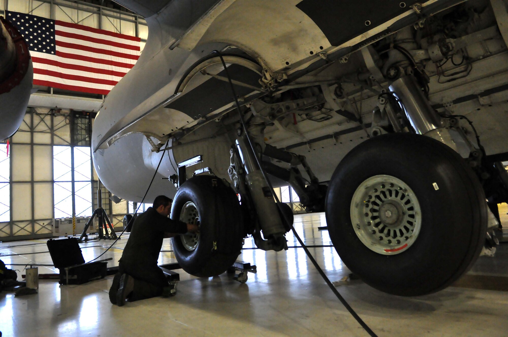 Staff Sgt. Joshua Gallagher, 446th Aircraft Maintenance Squadron crew chief, fastens bolts to a tire on a C-17 Globemaster III Jan. 17, 2012, at Joint Base Lewis-McChord, Wash. (U.S. Air Force photo/Airman 1st Class Leah Young)